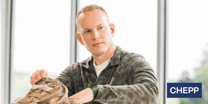 Person putting something in their backpack