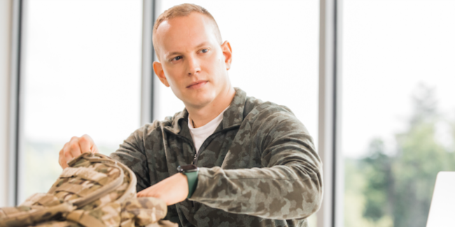 Person putting something in their backpack