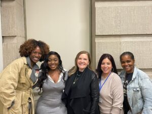 Group photo of SNHU president Lisa Marsh Ryerson and students smiling at the camera